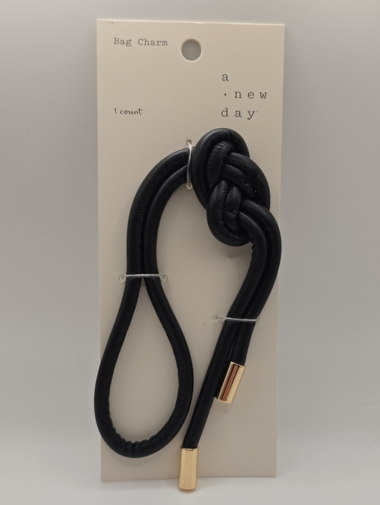 a new day Accessories - a new day Black Knot Bag Charm with Gold-Tone Caps